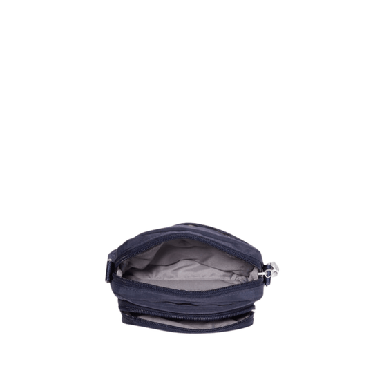 Small navy zippered crossbody bag with gray interior lining, shown open