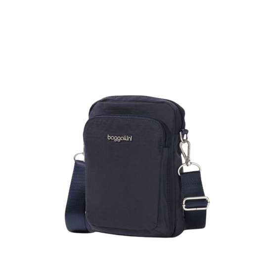 Navy crossbody bag with front zip pocket, adjustable strap, and visible logo