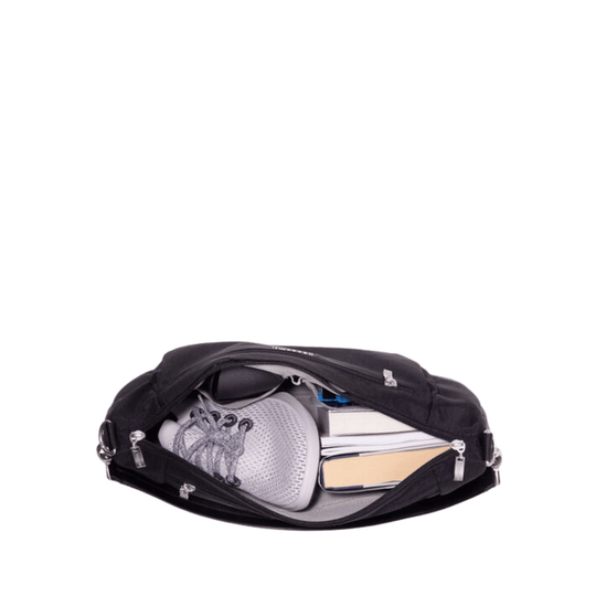 Black zippered messenger bag open to show a sneaker, books, and a phone inside