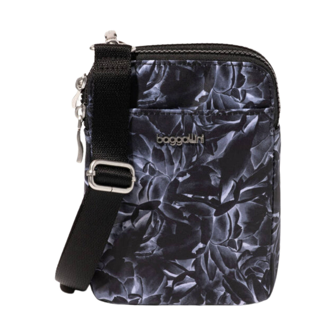 Black crossbody bag with floral print, adjustable strap, and front logo