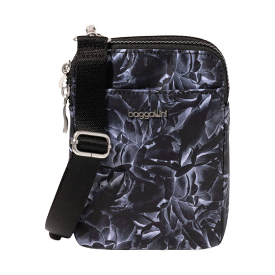 Black crossbody bag with floral print, adjustable strap, and front logo