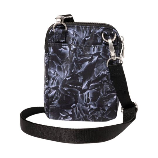 Black floral-pattern crossbody bag with a zip top, front pocket, and adjustable shoulder strap