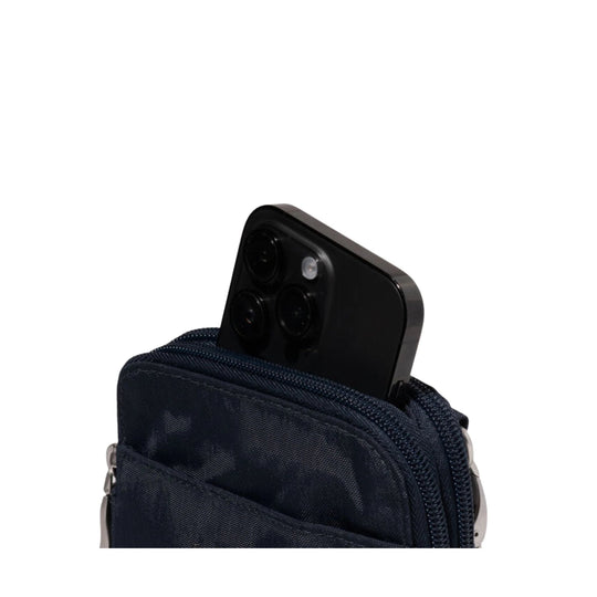 Navy zippered crossbody bag with a smartphone partially tucked into the front pocket