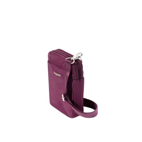 Purple crossbody wallet with front pocket, zip top, and wrist strap