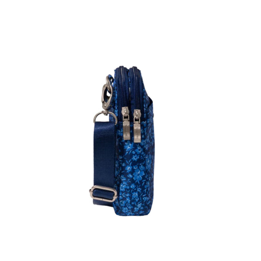Navy blue crossbody bag with floral print, double zippers, and an adjustable strap
