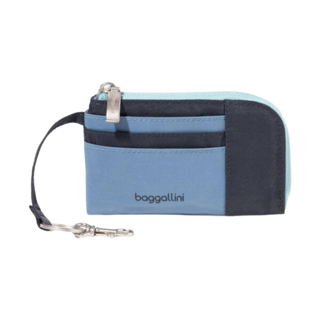 Small blue-and-black zip card case with wrist strap and visible baggallini logo
