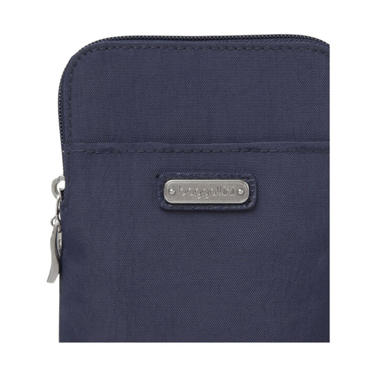 Navy zippered crossbody pouch with a front logo plaque and side zipper pull