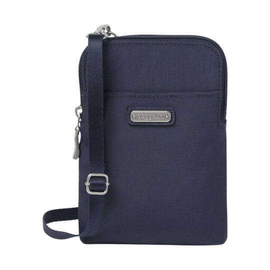 Navy zippered crossbody bag with front pocket, adjustable strap, and metal logo plate