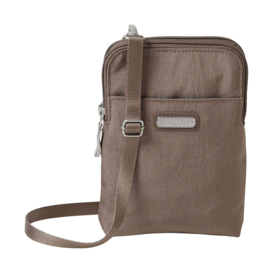 Brown small crossbody bag with front pocket, top zipper, and adjustable strap