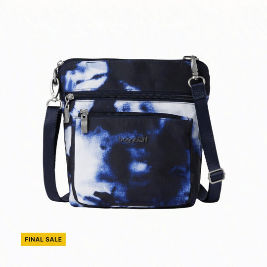 Navy and white crossbody bag with front zip pockets and a shoulder strap