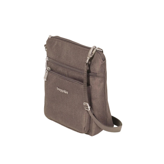Brown zip-top crossbody bag with front zip pockets and adjustable strap
