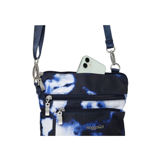 Small navy and white crossbody bag with two front zip pockets and a shoulder strap