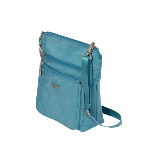 Blue crossbody bag with multiple zip pockets and an adjustable strap