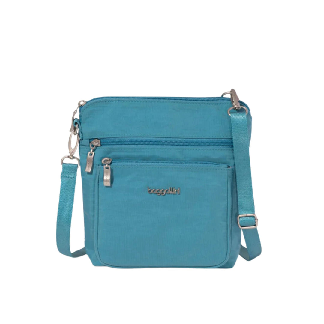 Blue crossbody bag with front zip pockets and adjustable strap