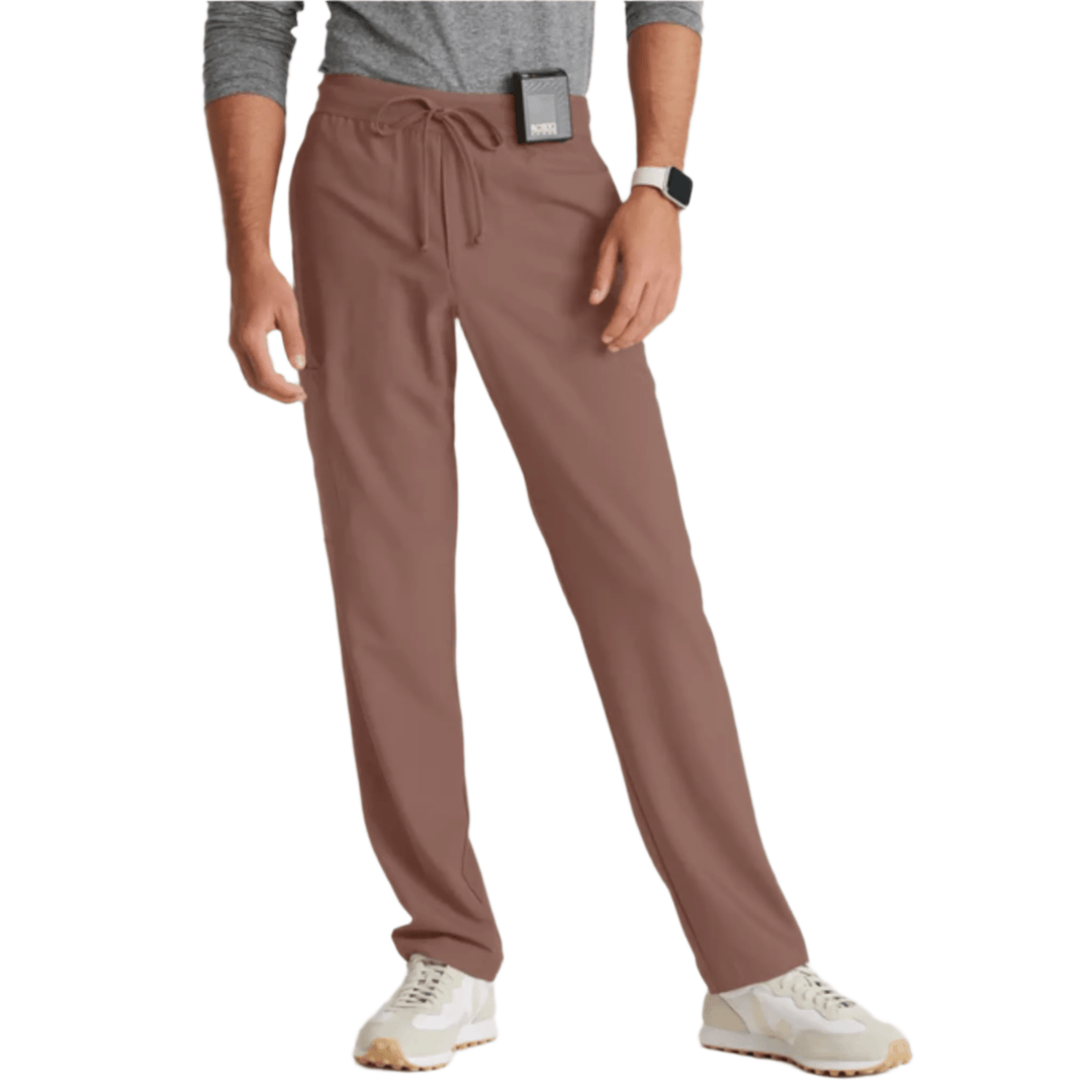 Brown straight-leg scrub pants with drawstring waist on a model