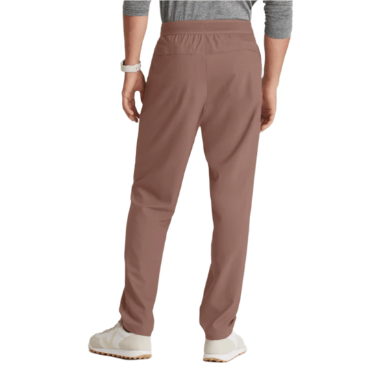 Back view of taupe straight-leg scrub pants with elastic waistband.