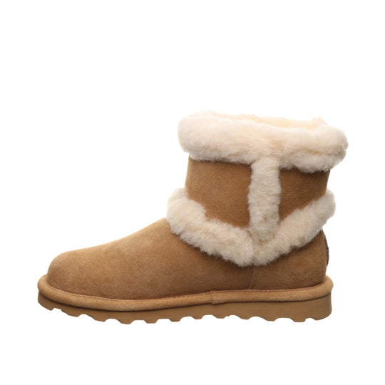 Tan suede ankle boot with white shearling cuff and trim, side view