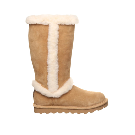 Tall tan suede boot with cream shearling trim and flat sole, side view