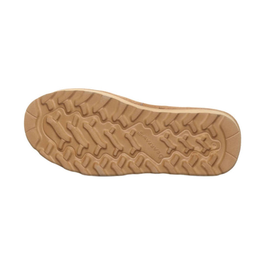 Tan rubber boot outsole with deep lugged tread