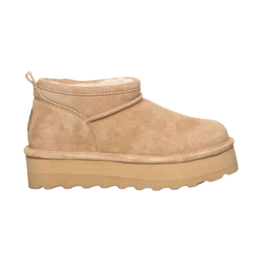 Tan suede ankle boot with a thick platform sole and a pull tab at the back