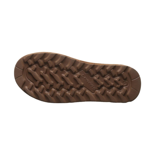 Brown rubber boot outsole with deep tread, shown from below