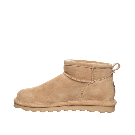 Tan suede ankle boot with rolled cuff and pull loop on a white background.