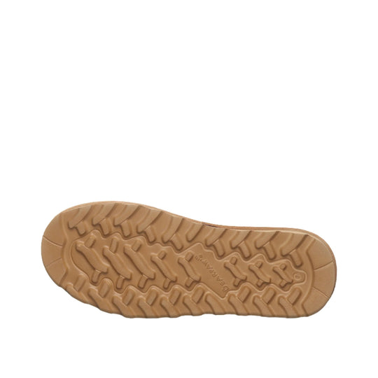 Tan boot outsole with deep tread pattern