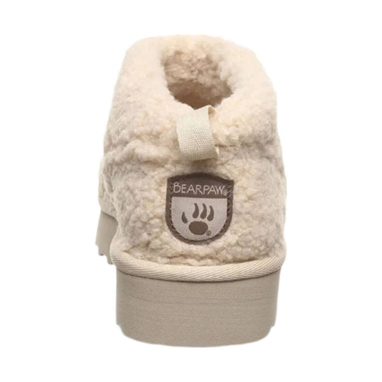 Cream fuzzy boot cuff with Bearpaw patch and beige sole