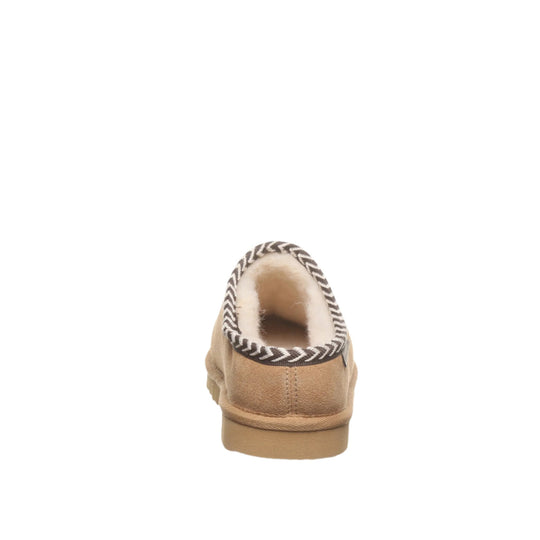Tan suede slipper boot with shearling collar and black-and-white zigzag trim, rear view