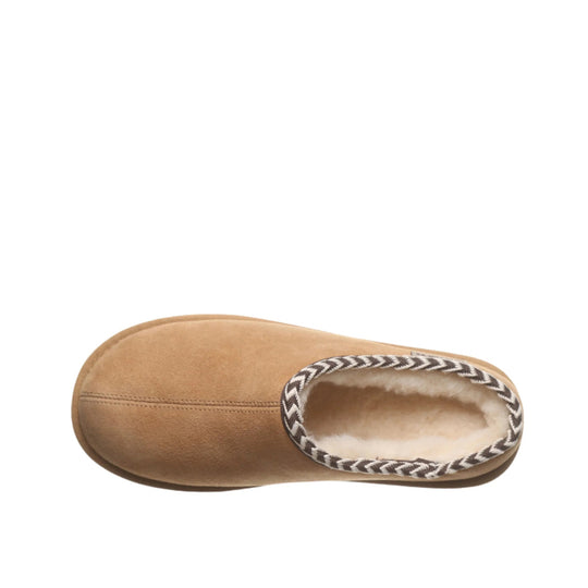Tan suede slip-on slipper with cream fleece lining and braided trim