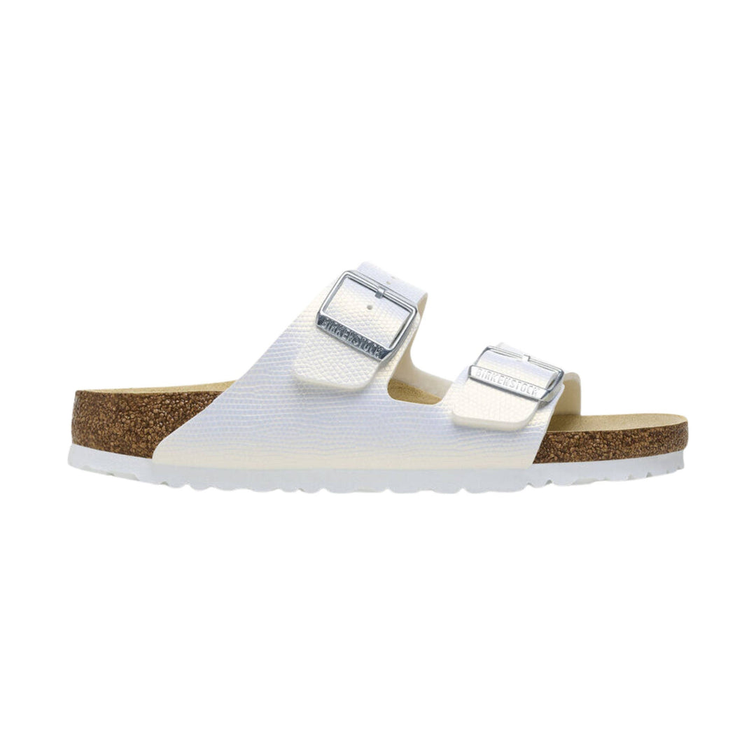 White double-strap slide sandal with cork footbed and embossed buckles