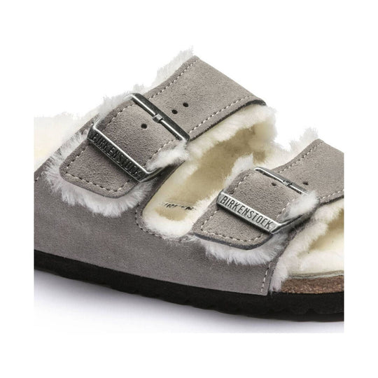 Shearling-lined suede sandal with two buckled straps