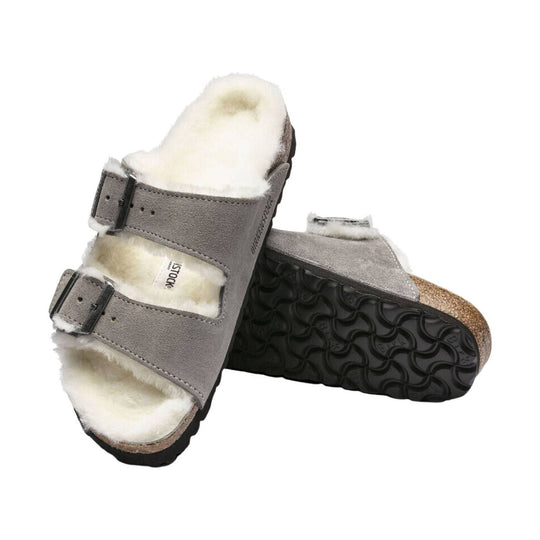 Shearling-lined suede two-strap sandal with black buckles and cork footbed