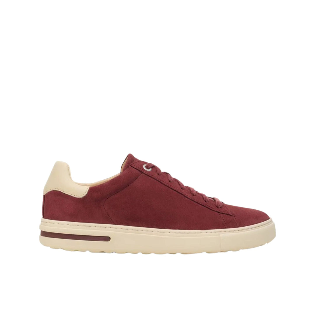 Maroon suede low-top sneaker with cream sole and heel tab
