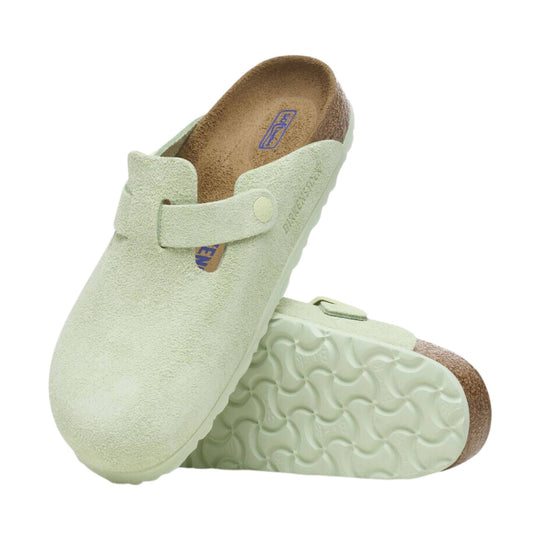 Light green suede clog with an adjustable strap and cork footbed, shown in top and sole views