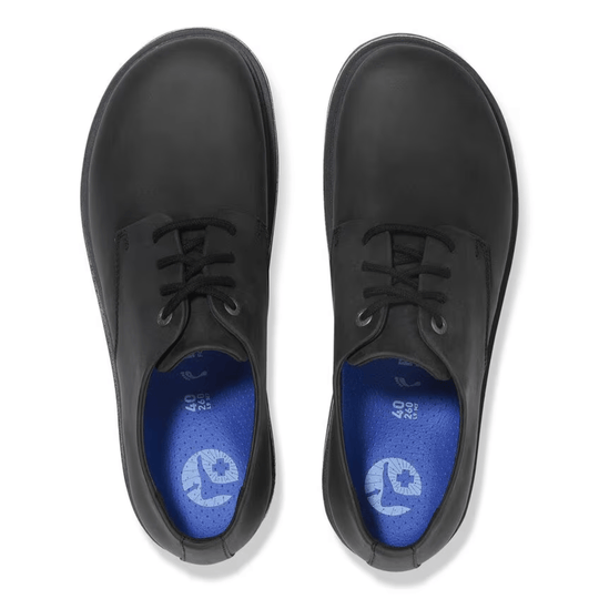 Black lace-up leather oxford shoes with blue insoles, top view