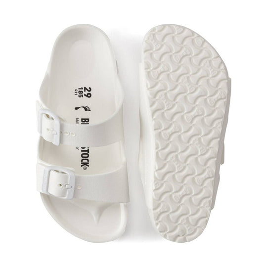 White double-strap kids sandal with buckles and textured sole, shown top and bottom