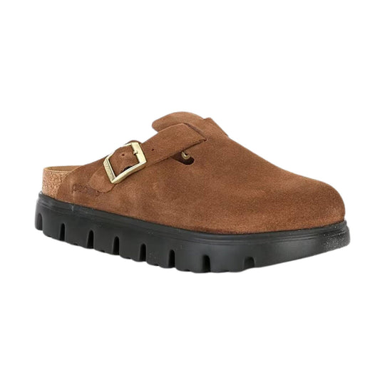 Brown suede clog with a brass buckle, closed toe, and black lug sole