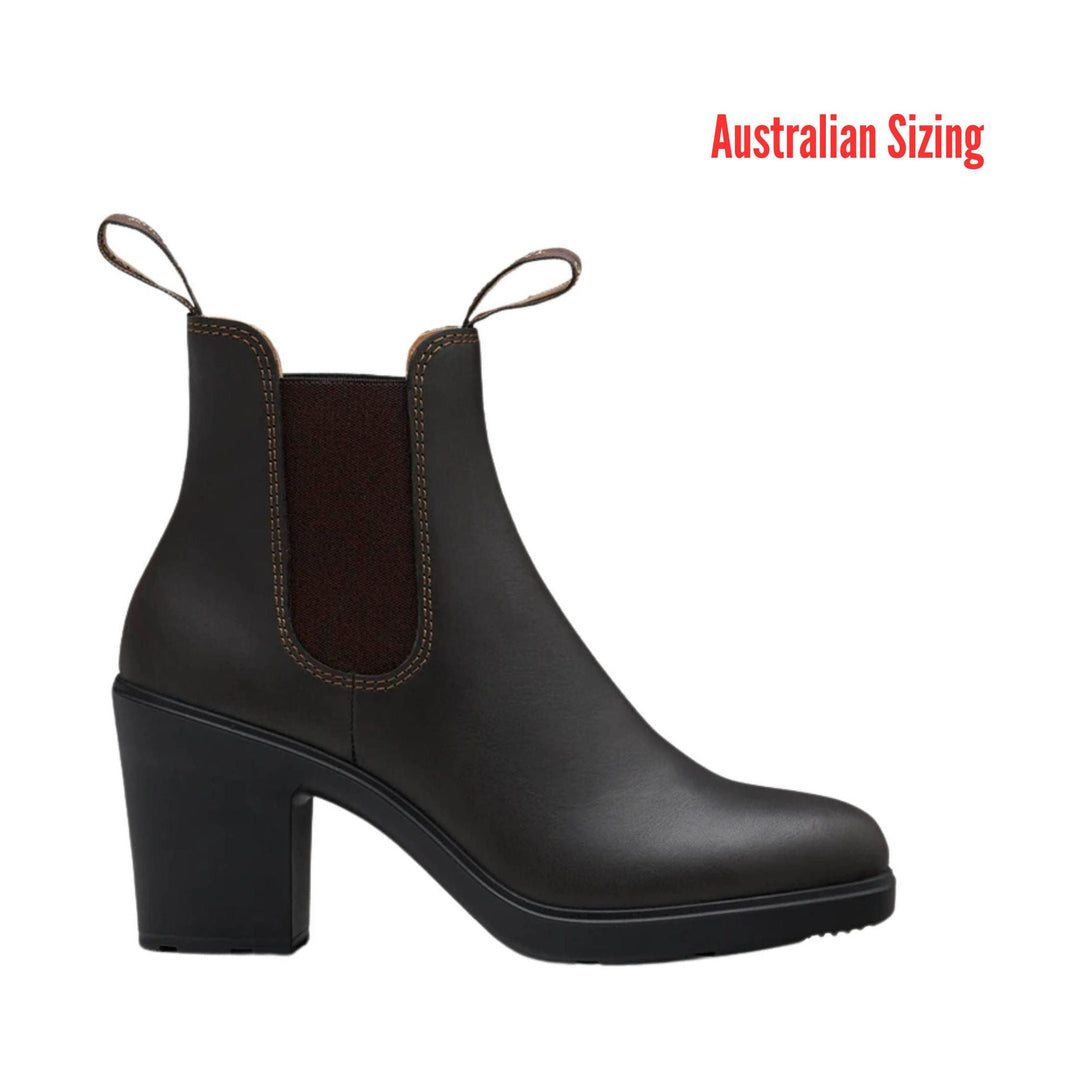 Black heeled Chelsea boot with side elastic panels and pull tabs