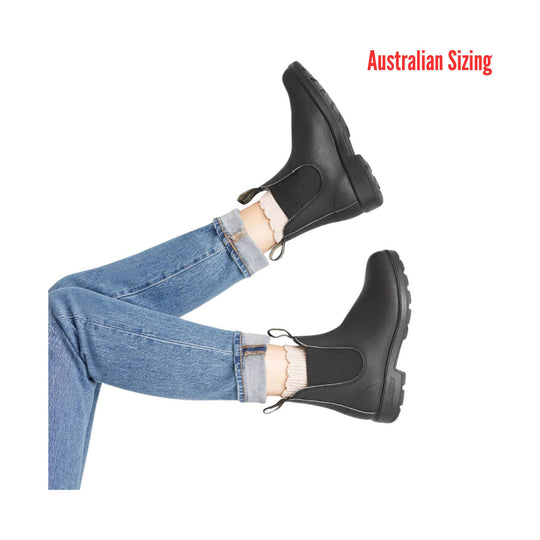 Black rubber boots worn with rolled-up jeans on a white background, with 'Australian Sizing' text.