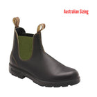 brown Chelsea boot with green lining on a white background