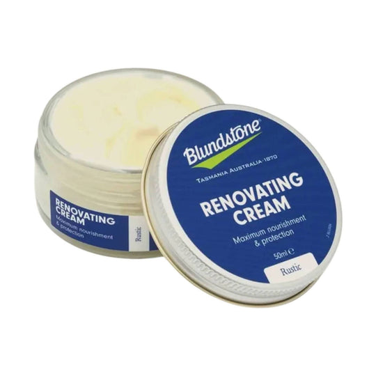 Open tin of Blundstone renovating cream with blue lid and cream-colored contents
