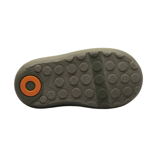 Dark gray boot outsole with circular tread pattern and orange heel accent