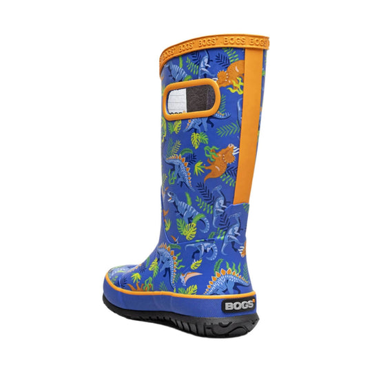Blue kids' rain boot with dinosaur print, orange trim, and side pull loop