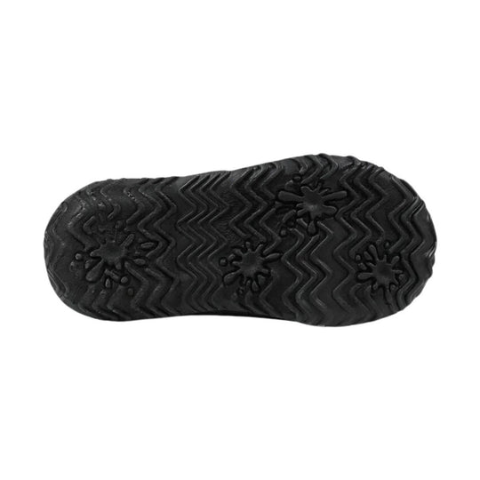 Black boot sole with zigzag tread and floral-shaped traction pattern