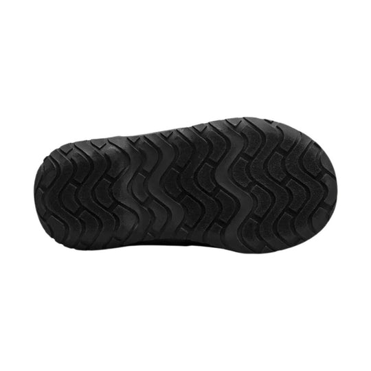 Black boot sole with wavy tread pattern