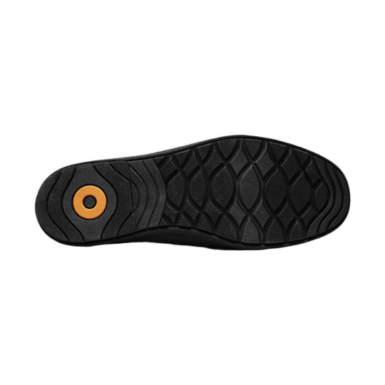 Black boot outsole with orange circular logo detail and deep tread pattern