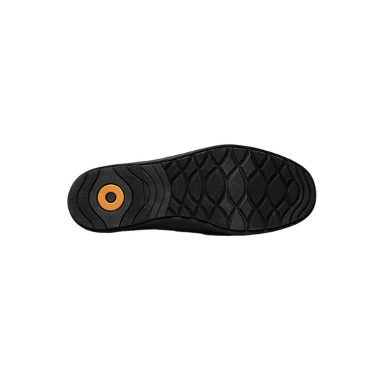 Black boot outsole with textured tread and an orange circular detail near the heel
