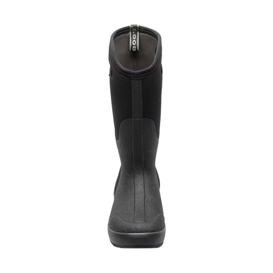Black pull-on rain boot with a tall shaft and textured rubber lower section, front view