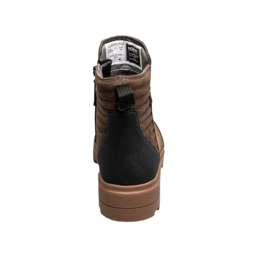Brown ankle boot with black heel panel and chunky tan sole, shown from the back